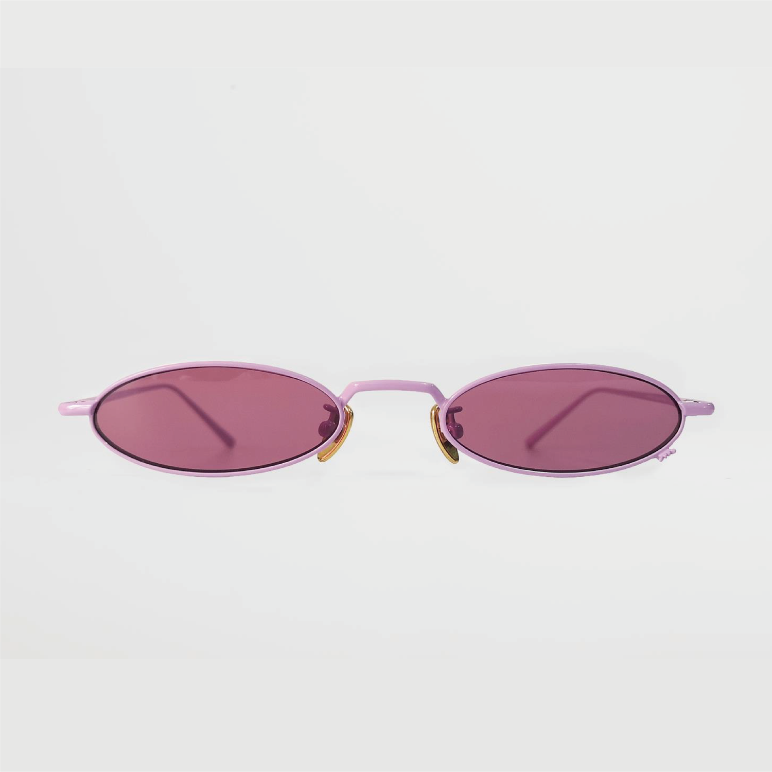 berry colour oval sunglasses in pink stainless steel frame with a tiny bug on the bottom of the right lens