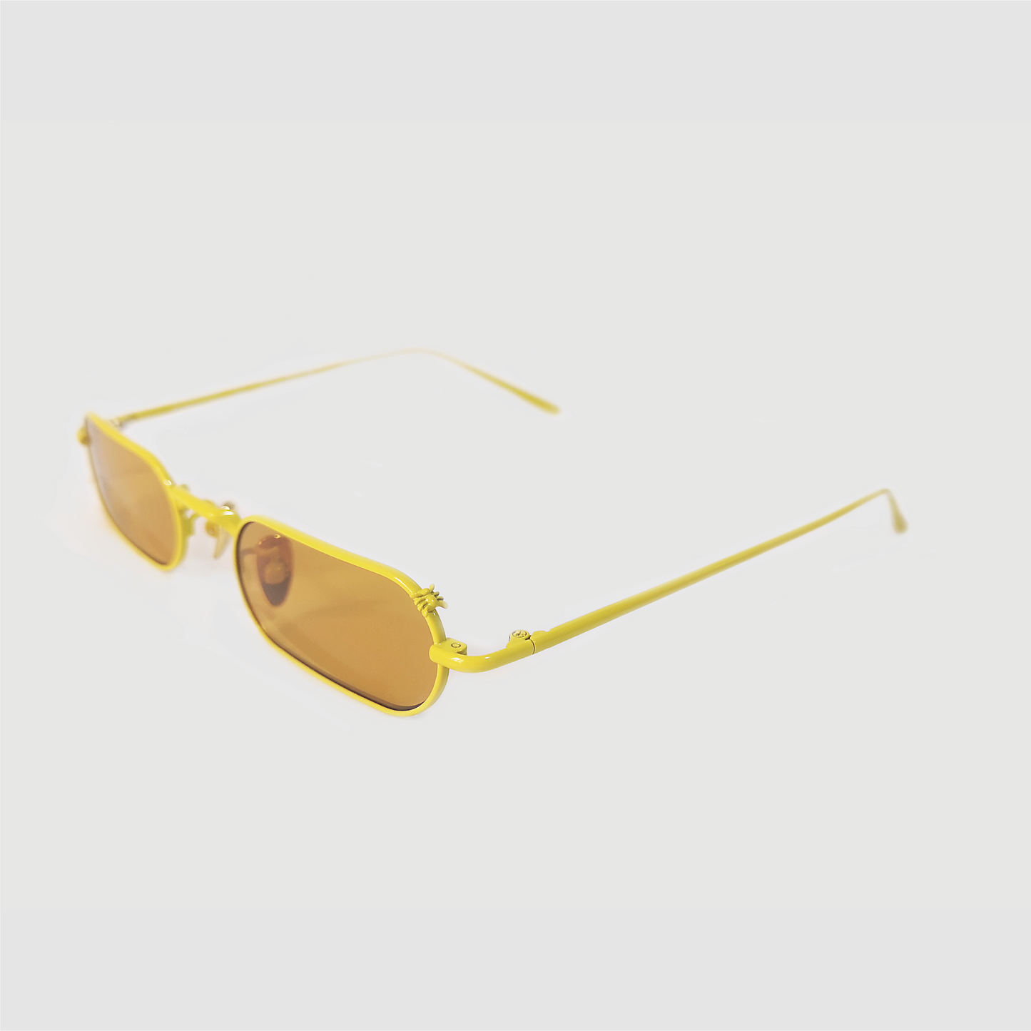 stadium shaped sunglasses with dark yellow lens and yellow stainless steel frame 45 angled