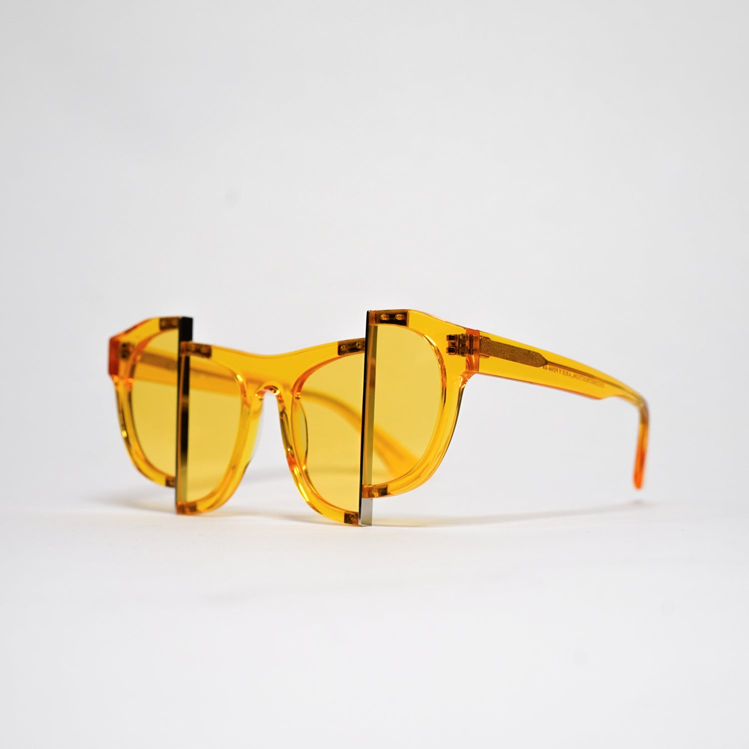 yellow jelly colour acetate frame with matching colour split polaroid lens on a 45 angle