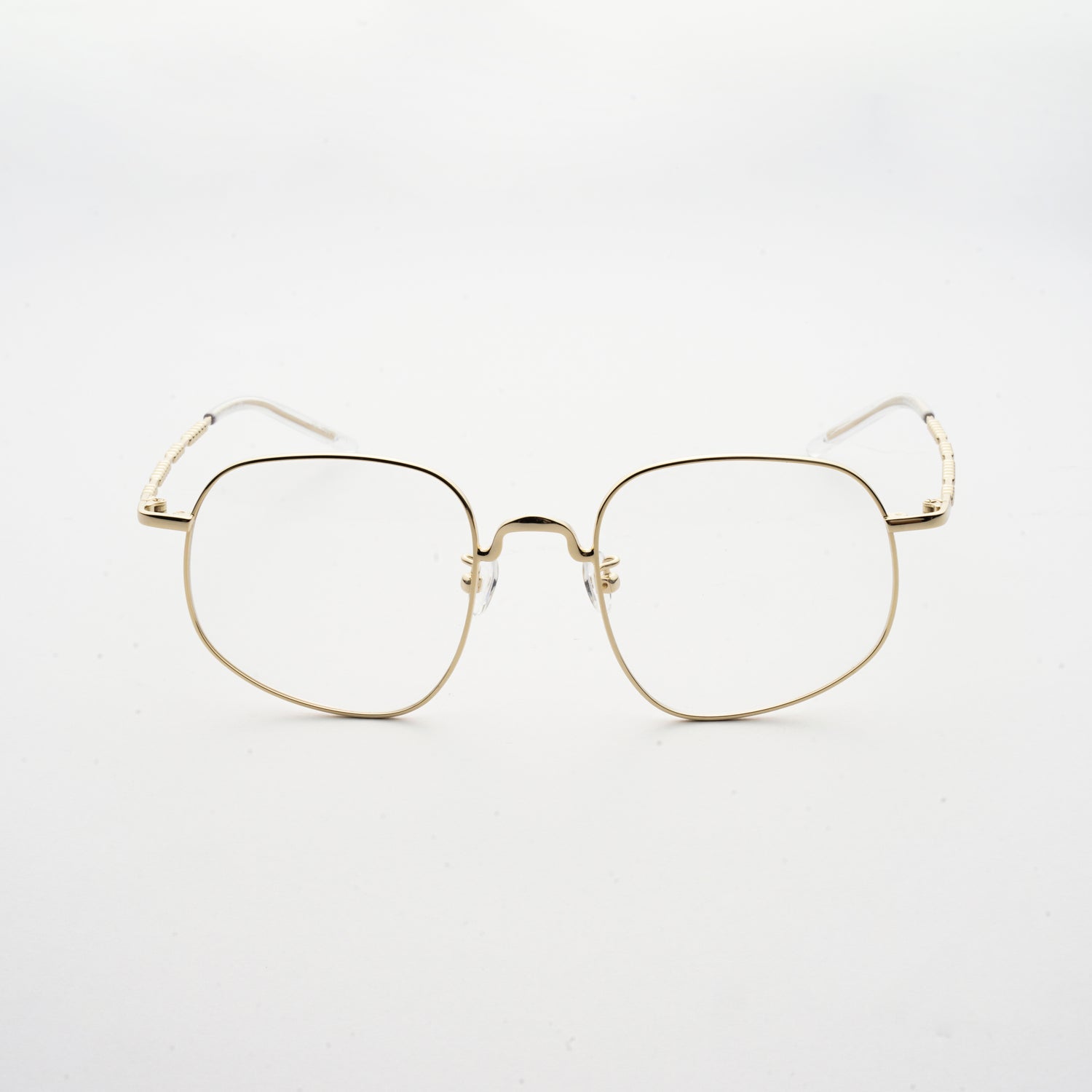 pale gold colour stainless steel optical frame with morse code details on the temples front