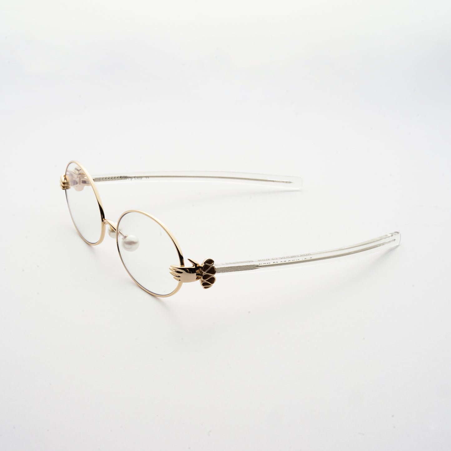 oval shaped lens with human hands style hinges and pearl nose pads 45 angled