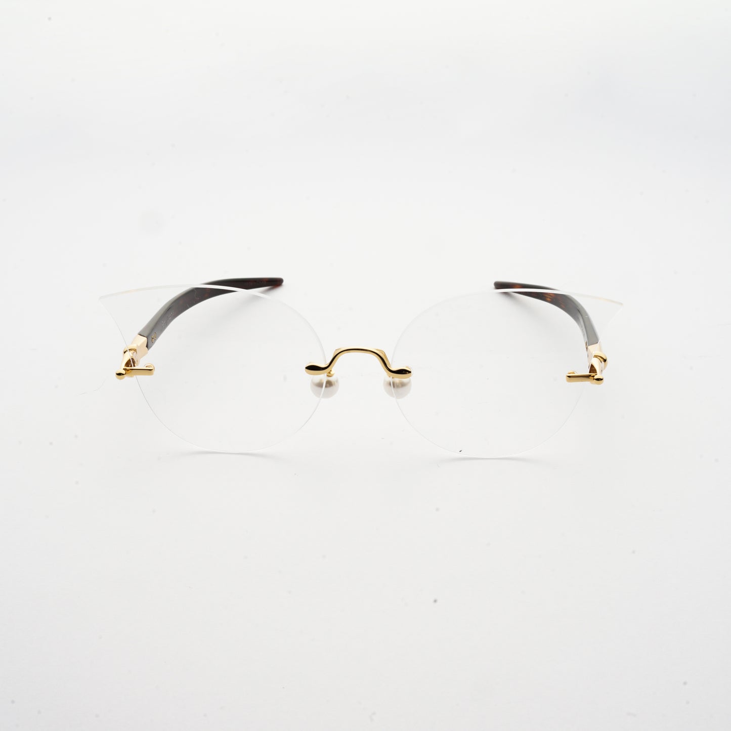 cat eye shaped optical lens with pearl nose pads and fountain pen style temples  front