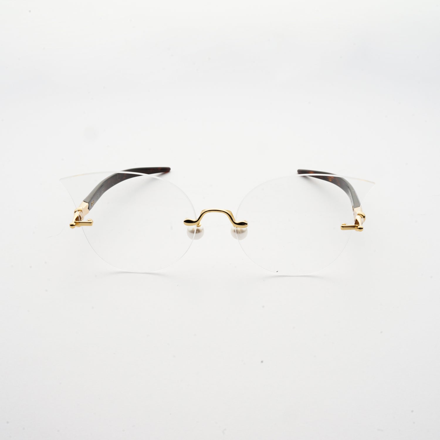 cat eye shaped optical lens with pearl nose pads and fountain pen style temples  front