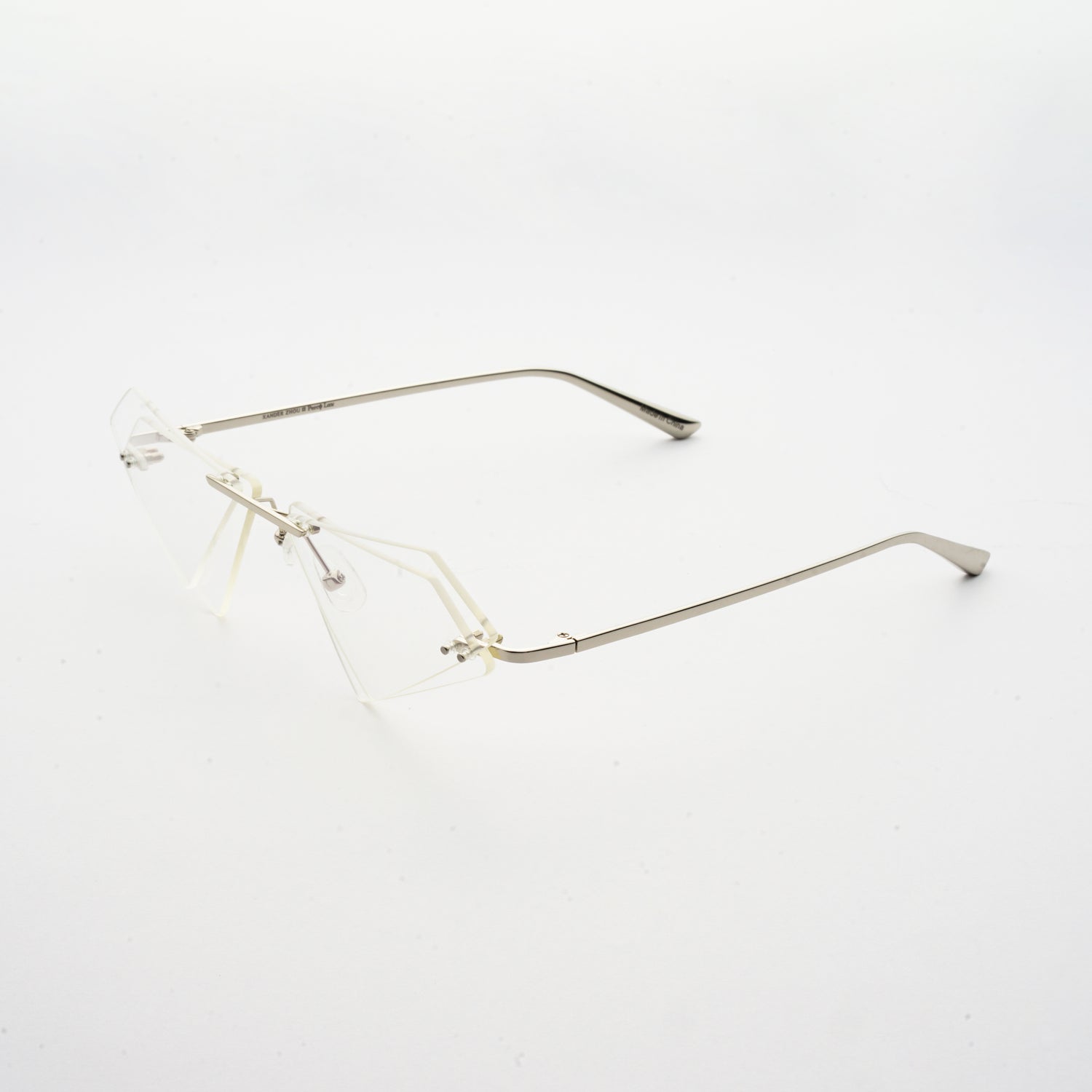 rimless sunglasses with double layered transparent lens in matrix shape and chrome colour frame 45 angled