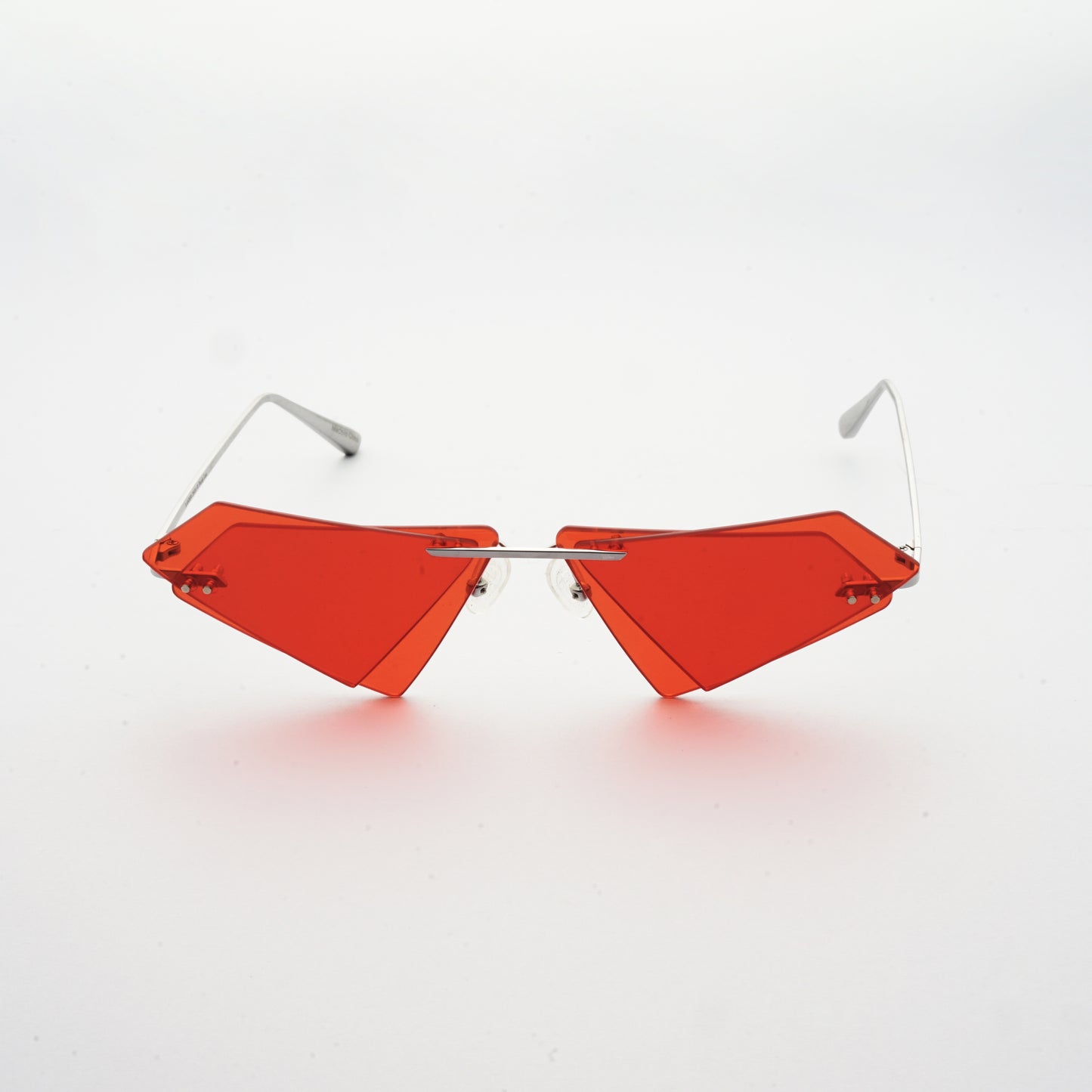rimless sunglasses with double layered red lens in matrix shape and chrome colour frame front 