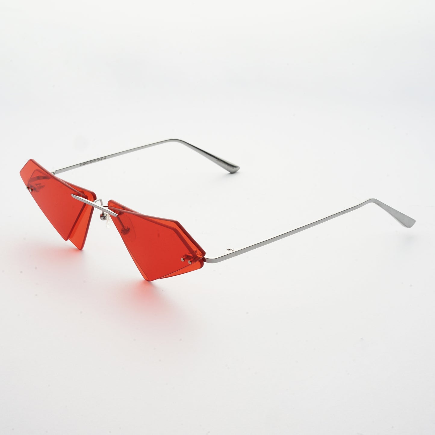 rimless sunglasses with double layered red lens in matrix shape and chrome colour frame 45 angled