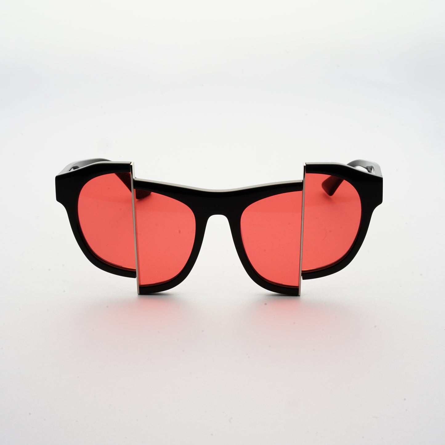 black acetate frame sunglasses with split red polaroid lens
